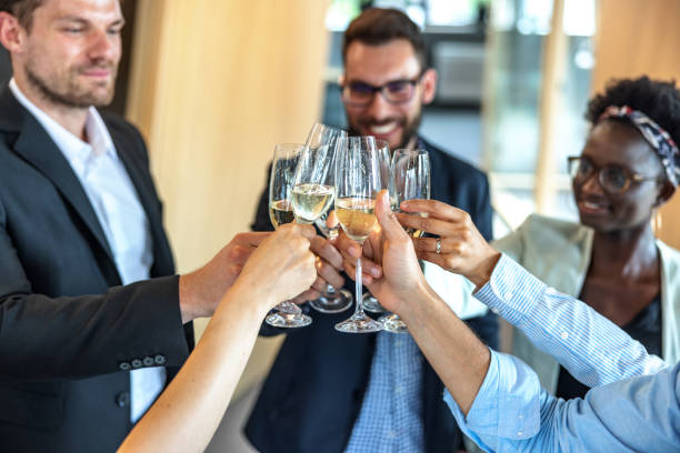 istock Business Colleagues Toasting At Work With Champagne 1447352199