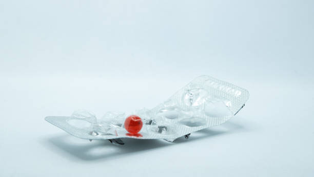 Blister with red pill. Vitamin E concept. stock photo