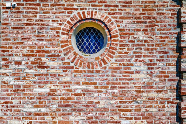 Brick red wall texture and window round shape