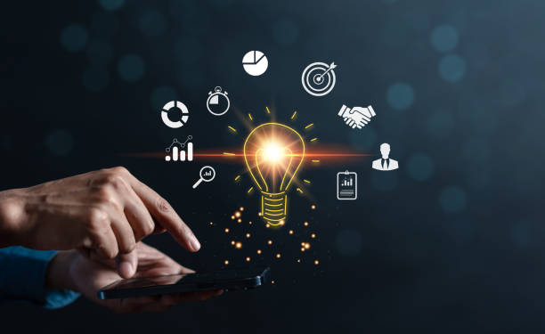 istock Businessman use smartphone management target business idea icon which for planning development leadership and customer target group concept. 1447353464