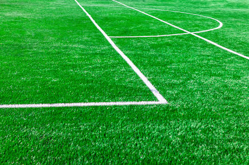 Marking on the football field . Sport field lawn background . Football penalty area