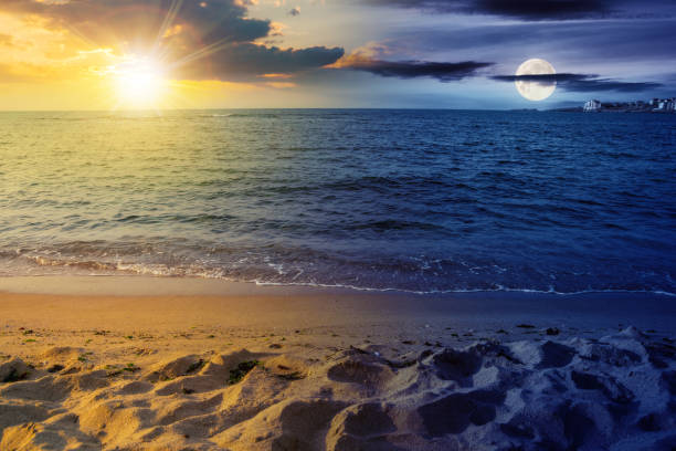 istock summer vacation background at the sea with sun and moon 1447353987