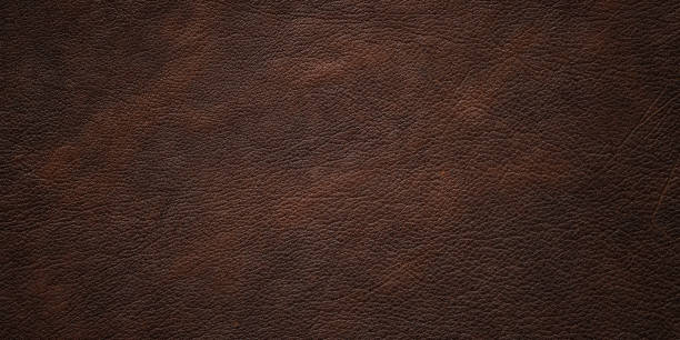 istock natural leather texture background, brown cowhide closeup 1447355161