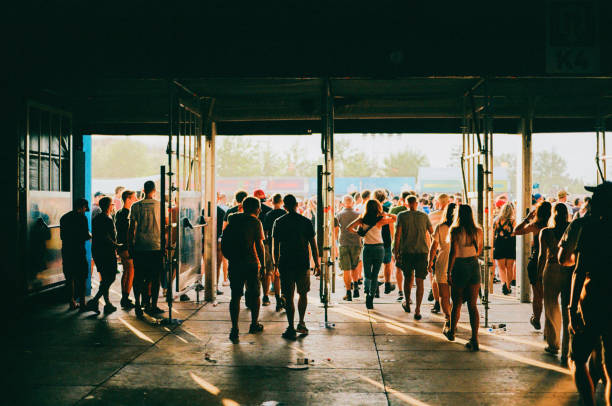 Crowd of people entering music festival Crowd of people entering music festival. Shot on film building entrance photos stock pictures, royalty-free photos & images