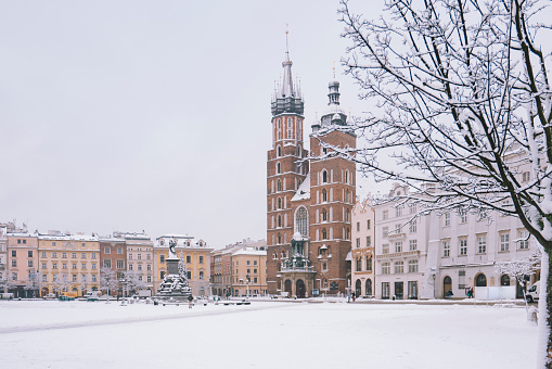Snow covered Rynek Glowing in old town Krakow Poland