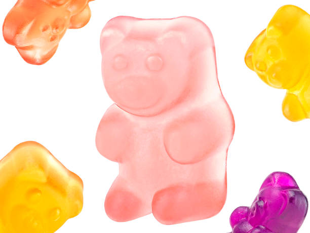 istock Sweet jelly candy - colored gummy bears isolated on a white background. 1447357014