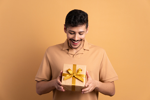 Happy man receiving Christmas present
