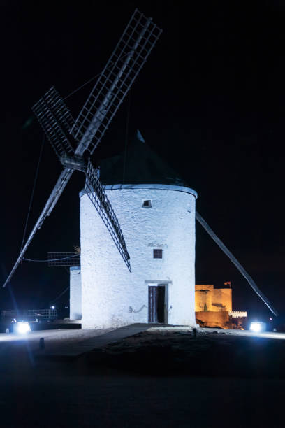 istock Winds stands on hilltop enjoying the peaceful twilight moment, Consuegra, Spain 1447358469