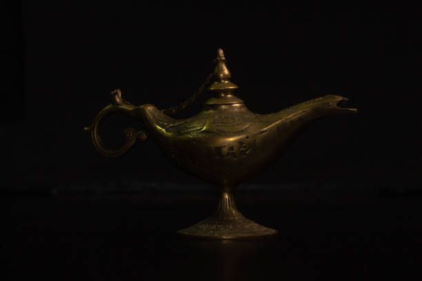 istock Aladdin's magic lamp isolated on black background 1447359587