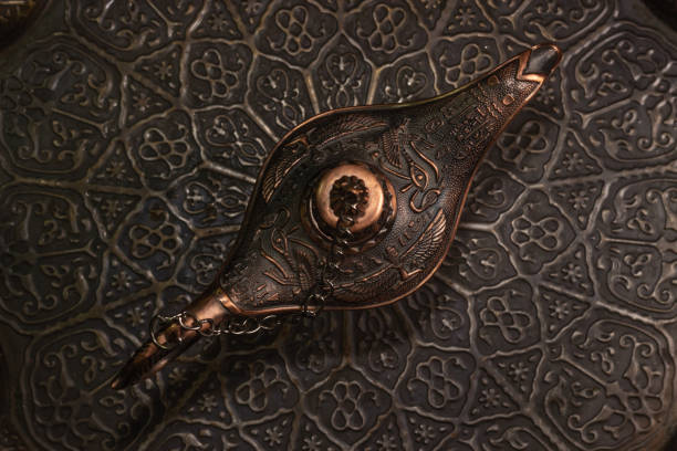 istock Aladdin's magic lamp isolated on black background 1447359612