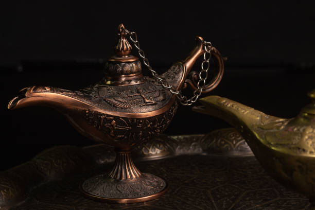 istock Aladdin's magic lamp isolated on black background 1447359632