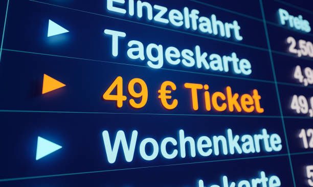 49 Euro ticket for travelers and working people who rely on local public transport. Symbol for the upcoming public transport ticket in Germany. Station monitor for purchasing the 49-Euro ticket. travel refund stock pictures, royalty-free photos & images