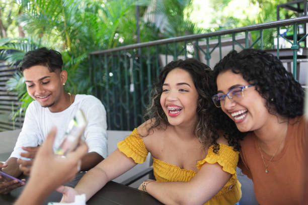 istock Young friends at a cafe outdoors 1447362610