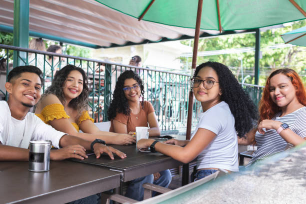 istock Young friends at a cafe outdoors 1447362636