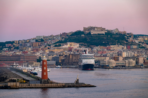 The lighthouse looks spectacular at sunrise in the port of Molo Di San Vincenzo, Naples.