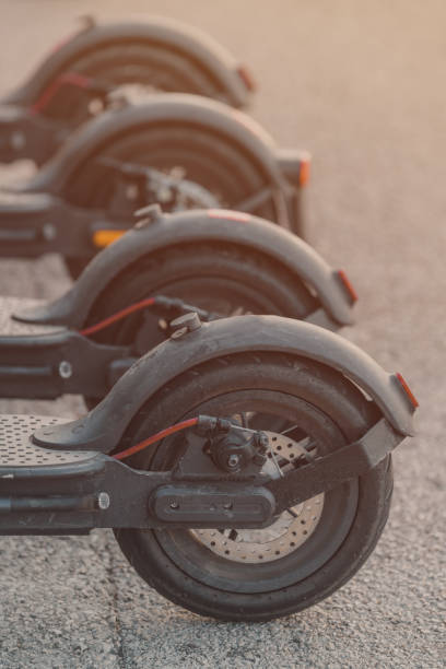 istock Electric scooters parked at city square for rent 1447364961