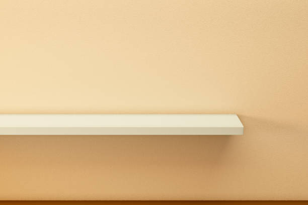 istock yellow empty shelf on yellow orange stucco wall. 1447365924