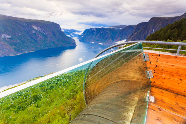 Fjord landscape at Stegastein viewpoint Norway Aurlandsfjord landscape from Stegastein viewing point, clouds over sea water surface. Norway Scandinavia. National tourist route Aurlandsfjellet. stegastein viewpoint stock pictures, royalty-free photos & images