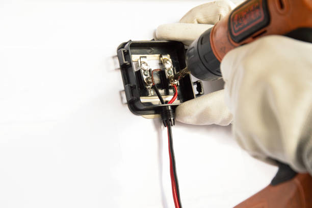 istock Technicians are connecting wires to solar panels. 1447366309