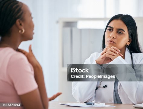 istock Doctor, patient consultation and medical healthcare discussion with women at consulting clinic, hospital and community gp. Black woman, office and health care therapist listen during routine checkup 1447371543