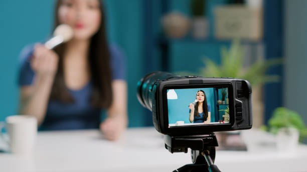 istock Young influencer reviewing makeup brush on video 1447372262