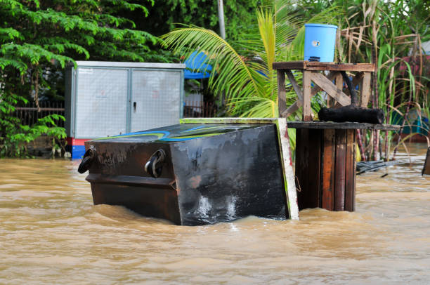 istock an overturned garbage can washed away by floodwaters 1447372280