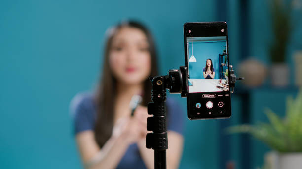 istock Content creator recording lifestyle vlog on filming camera 1447375850