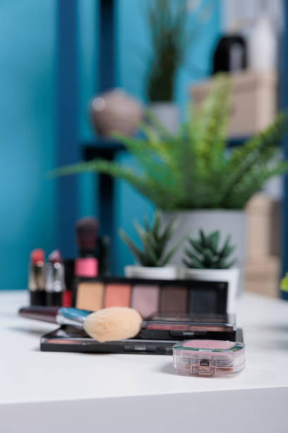 istock Cosmetics product standing on white table in studio with blue backgrounnd 1447377066