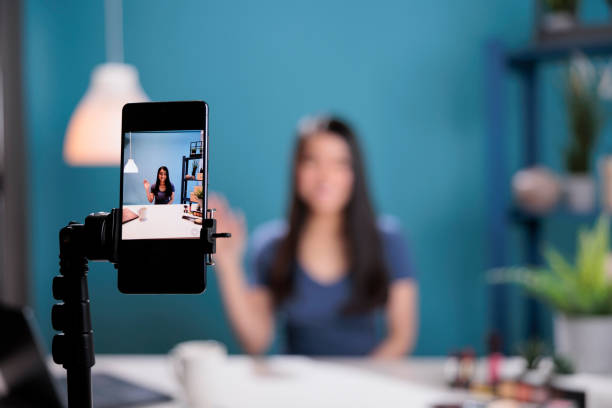 istock Behnind the scene of content creator talking with remote subscribers 1447377184