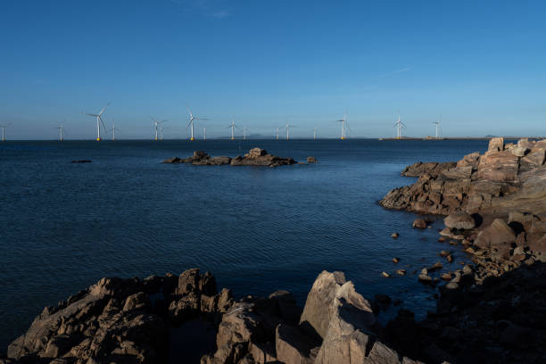 istock Wind power station on the shore rock 1447379537