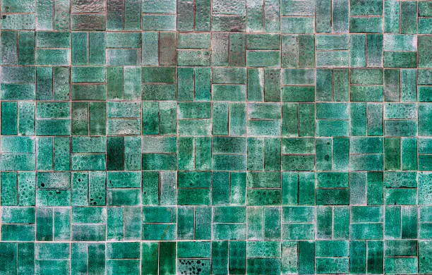 Photo of Green ceramic tile background. Old vintage ceramic tiles in green to decorate the kitchen or bathroom