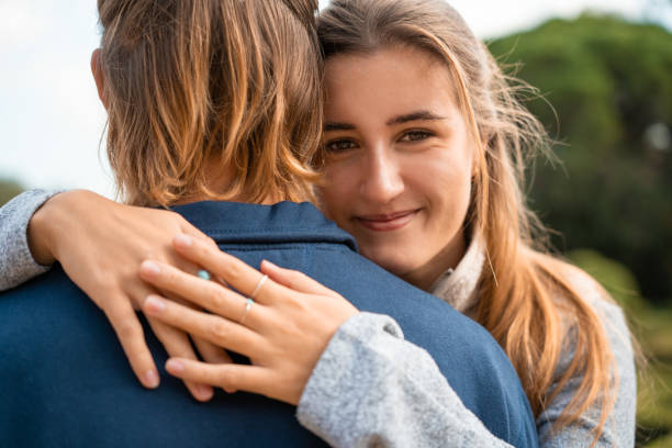 istock Portrait of a young couple hugging. 1447386877