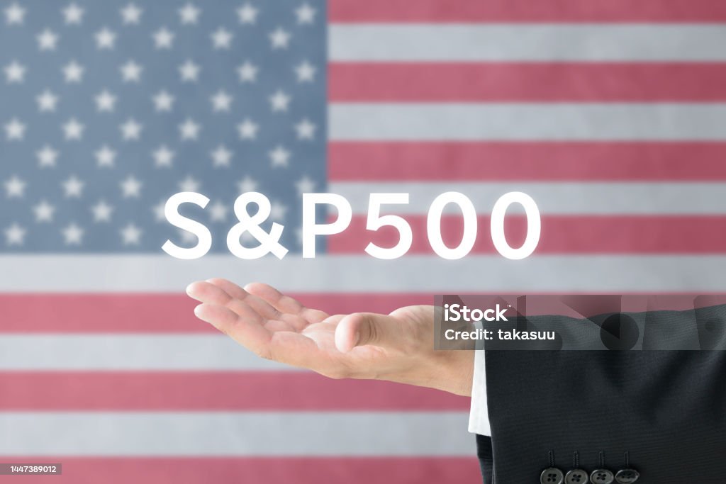 Busienss man's hand and "S&P 500" word on American national flag background Stock Market and Exchange Stock Photo