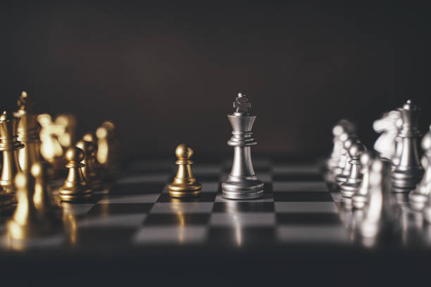 istock concept Chess pieces are arranged on a chessboard. The beginning of a chess game. Chess as a symbol of leadership, struggle, victory, strategy, business. Retro style.coppy space. 1447391094