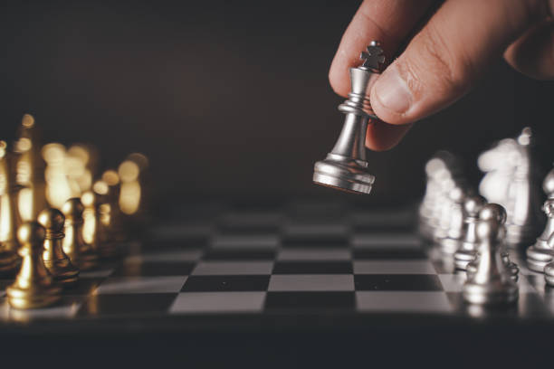 istock concept Chess pieces are arranged on a chessboard. The beginning of a chess game. Chess as a symbol of leadership, struggle, victory, strategy, business. Retro style.coppy space. 1447391105
