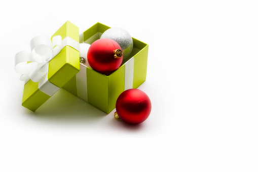 Gift box with red ribbon on white. This file is cleaned, retouched and contains clipping path.