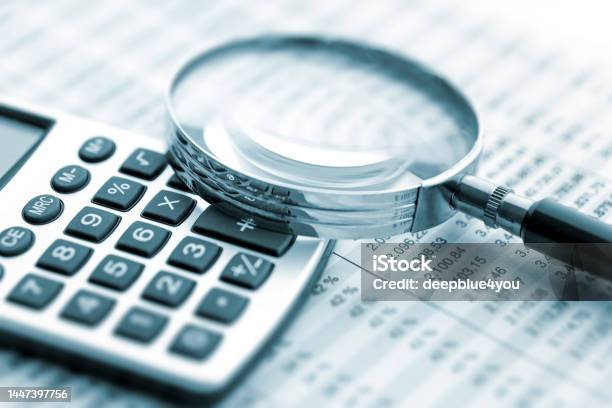 Magnifying Glass On Financial Chart Stock Photo - Download Image Now - Magnifying Glass, Audit, Loupe