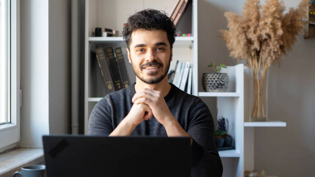 istock Entrepreneurial young businessman looking at camera 1447398394