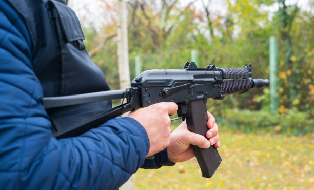 istock A man holds a Kalashnikov assault rifle in his hands for firing from the hip 1447398607