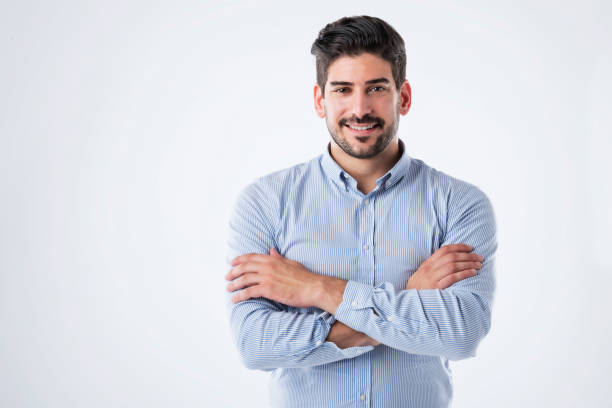 istock Smiling and handsome man wearing casual clothes while standing at isolated background 1447400594