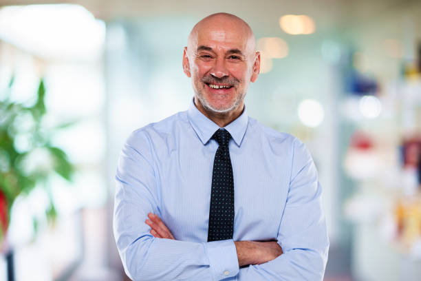 istock Middle aged businessman standing at the office 1447400701