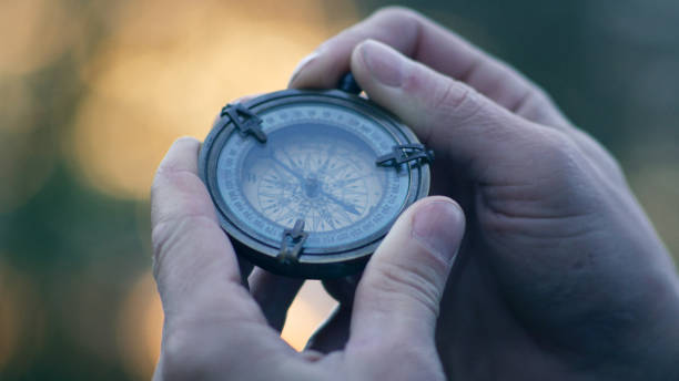 istock Person holding a compass. Lost in journey 1447401851