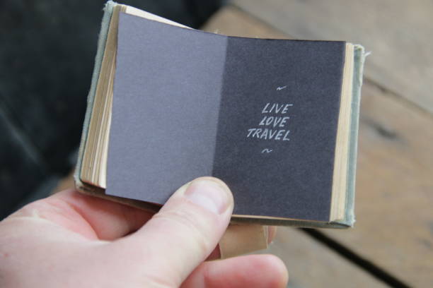 istock Live Love Travel inscription on a book. 1447403156