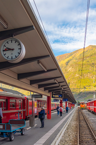 TIRANO, ITALY - OCTOBER 28,2022: Bernina express of Rhaetian railway line at the train station in Tirano