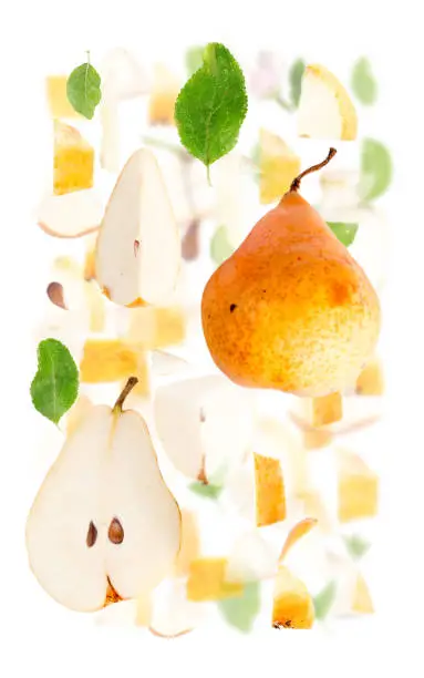 Abstract background made of Orange Pear fruit pieces, slices and leaves isolated on white.