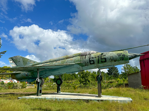 Santa Clara, Cuba - December 6, 2022: The old Mig military plane used as decoration in the Sandino district. The plane looks weathered and abandoned.