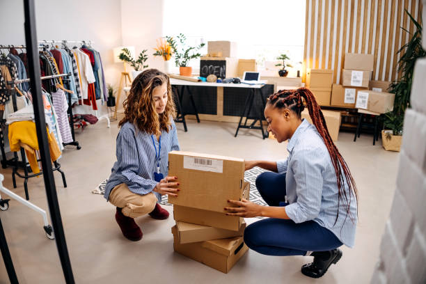istock Two women preparing packages for shipping 1447404029