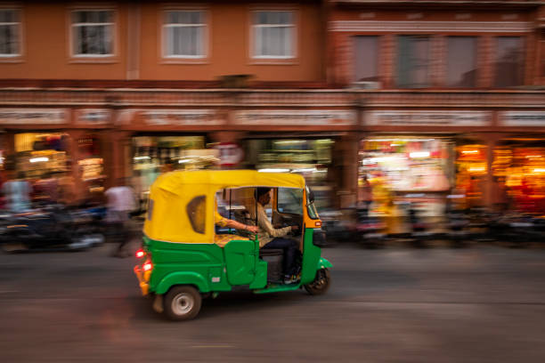 istock Indian man drives auto rickshaw (tuk-tuk), India 1447406591