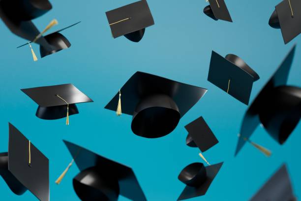 istock abstract background consisting of master's caps flying over the blue background. 3D render 1447408255
