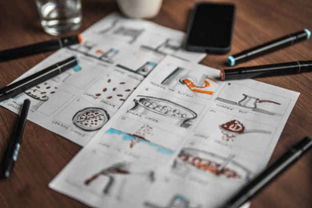 istock Storyboard Editors Table; Coffee, Colored Pencils And A Smartphone 1447408600